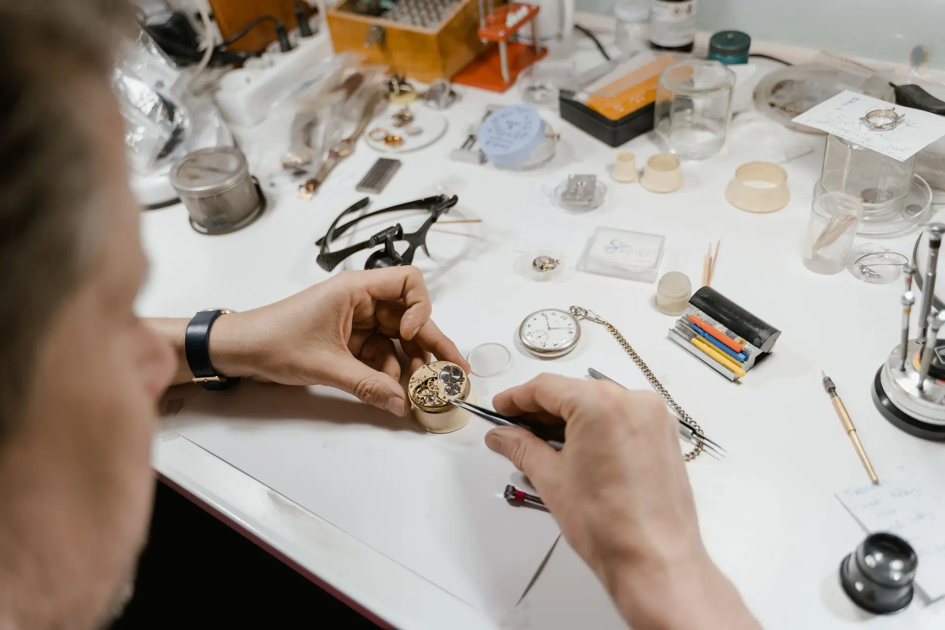Watch parts arranged on a clean work surface