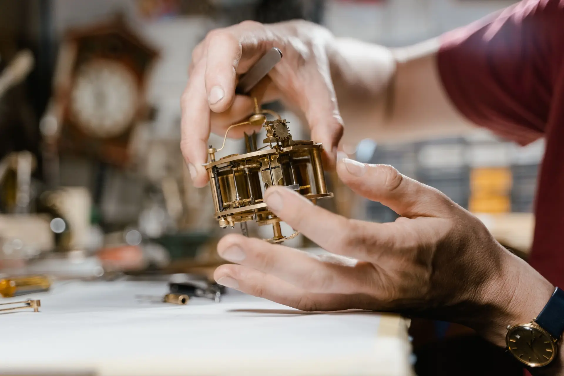 Clock movement being handled during repair